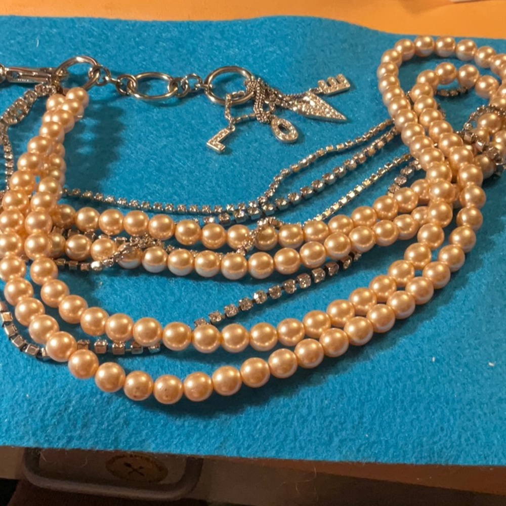 Vintage pearl and rhinestone necklace with charms at closure